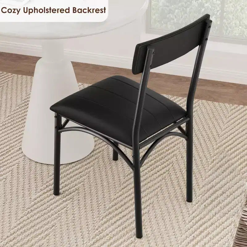 Four dining chair sets, with soft cushions and ergonomic high backs. Strong steel legs, suitable for dining rooms and kitchens. Black color.