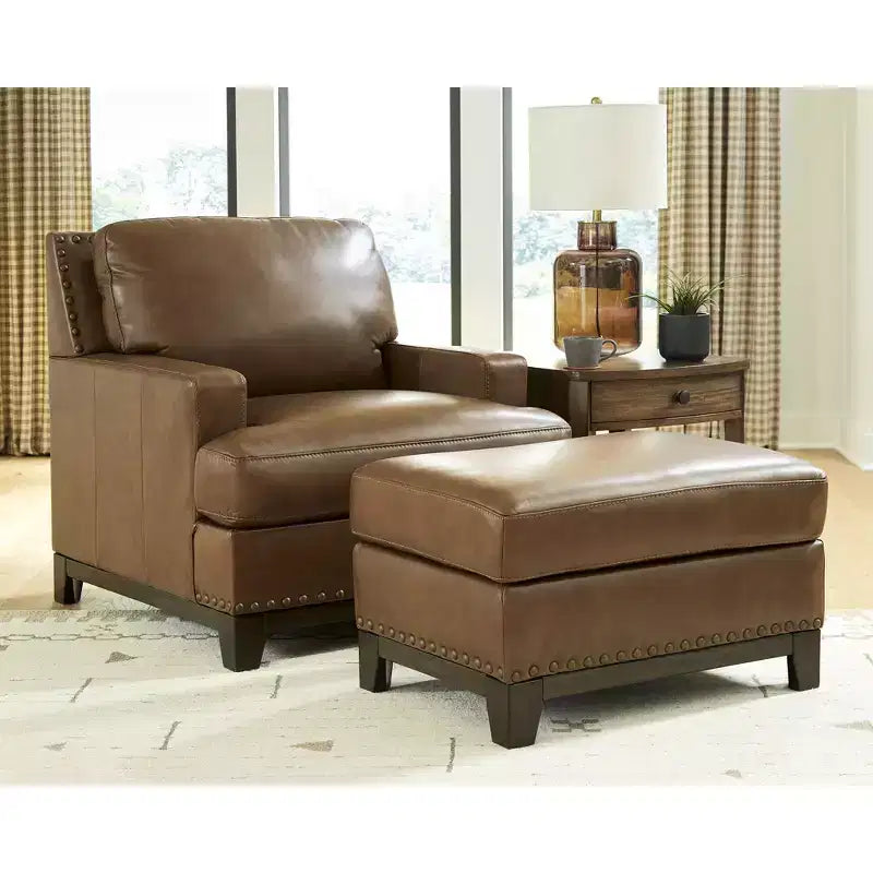 Signature Design by Ashley Brendola Ottoman, Top Grain Leather Cushion with Nailhead Trim, Amber