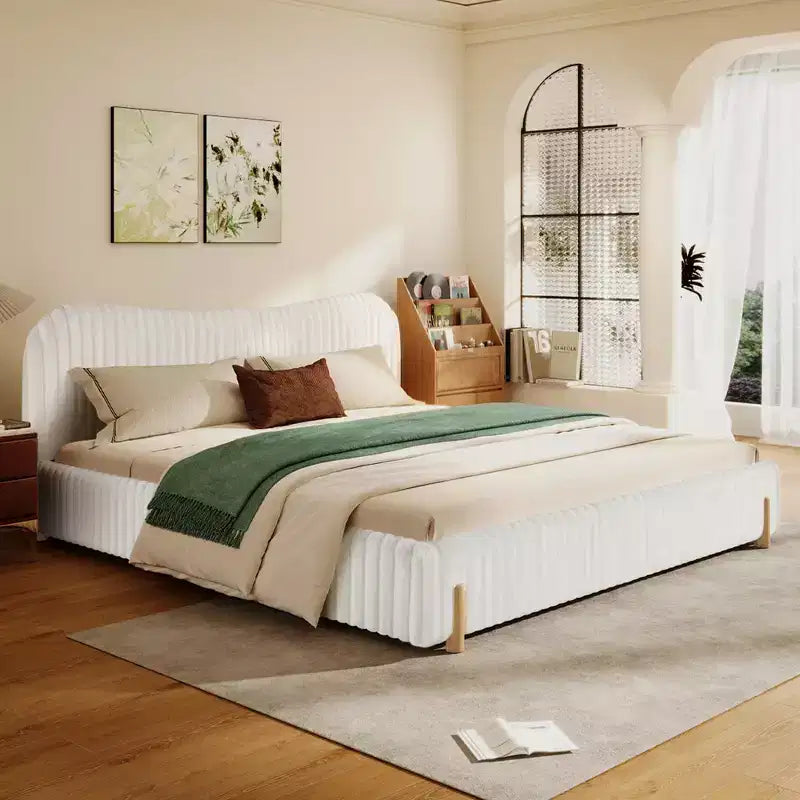 White Plush Upholstered Bed Frame with Wavy Headboard, Vertical Stitching and Warm Wood Legs for Elegant Contemporary Bedrooms, King